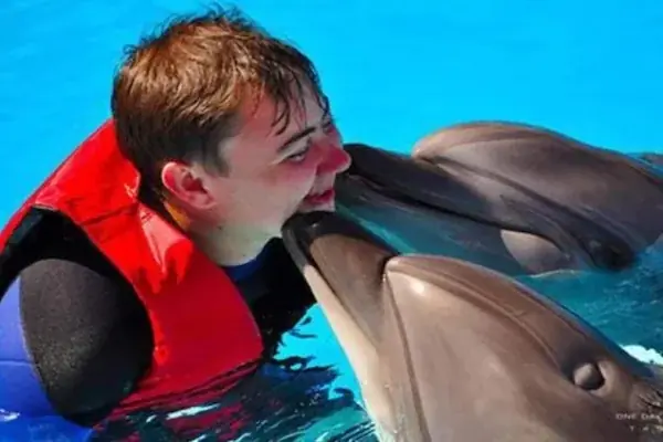Family Swimming with Dolphins